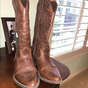 Brown cowboy boots lightly worn
